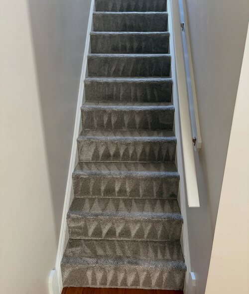 Stair carpet cleaned by hand, tread by tread